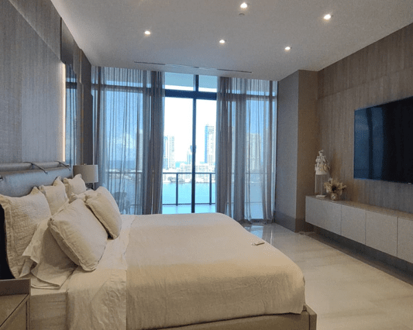 Light-grey drapery installed in a modern bedroom.