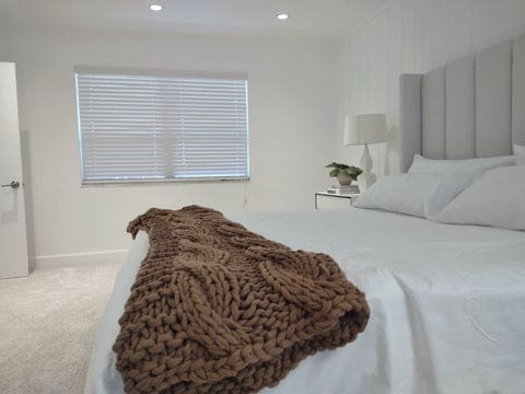 Faux-wood blinds white in a nordic style bedroom