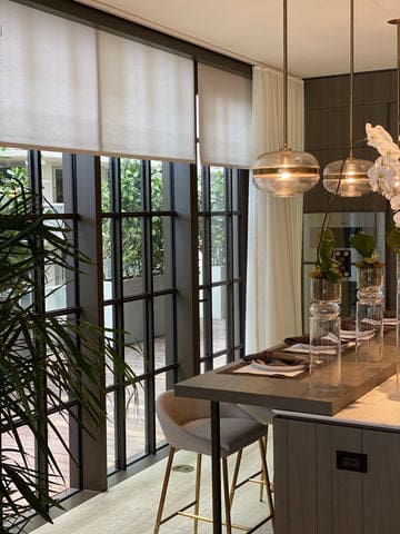Industrial style windows with outside mount roller shades