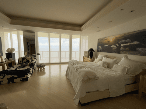 Sheila Elias Bedroom with white solar screen shades installed on sliding glass doors