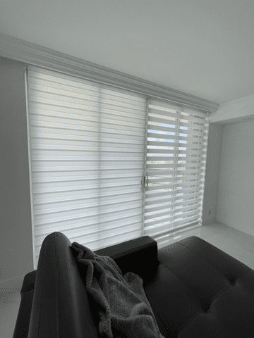 zebra shades, mounted on a sliding-glass door, provide privacy and light filtering in a living room 