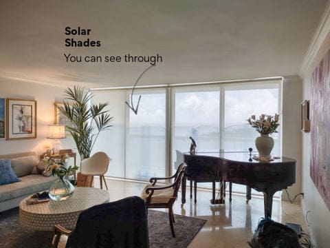 Living room with solar shades for sliding doors
