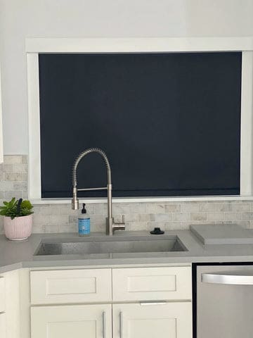black blackout shades over the sink