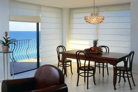 Coastal style Window Treatments on sliding glass door. Front ocean living room