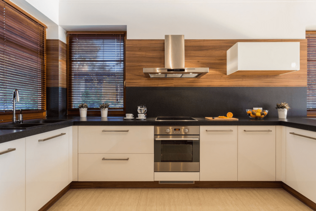 Brown faux wood blinds installed in a modern kitchen