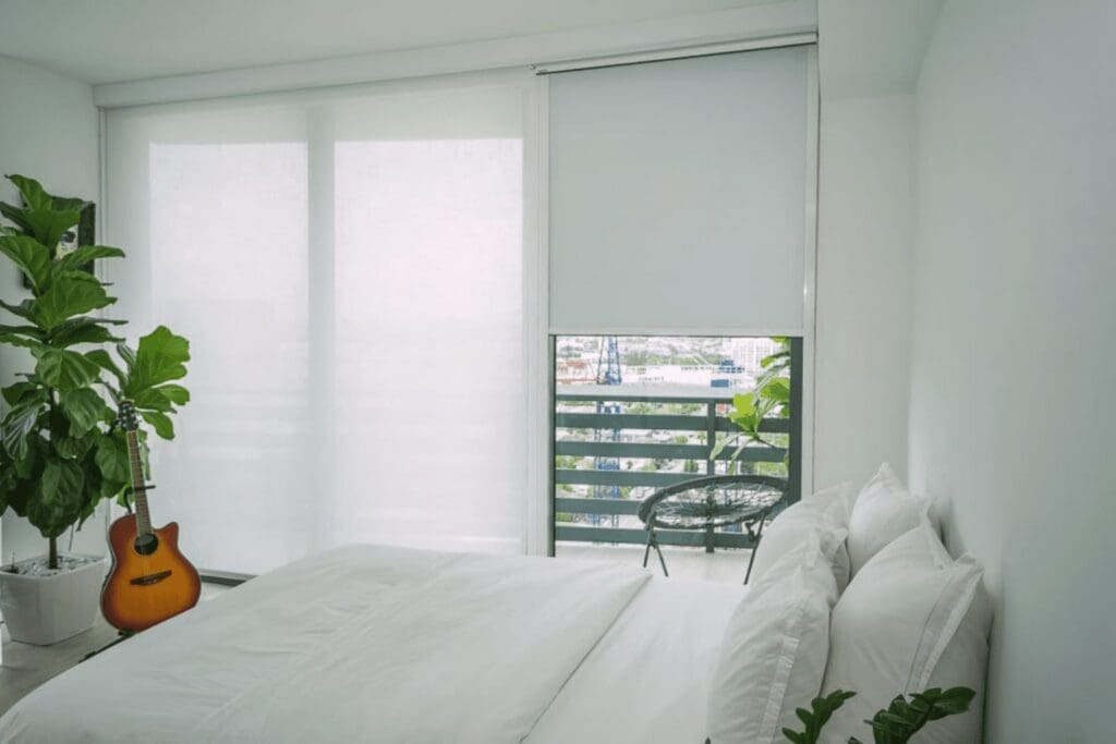 Apartment with blackout and solar shades in bedroom